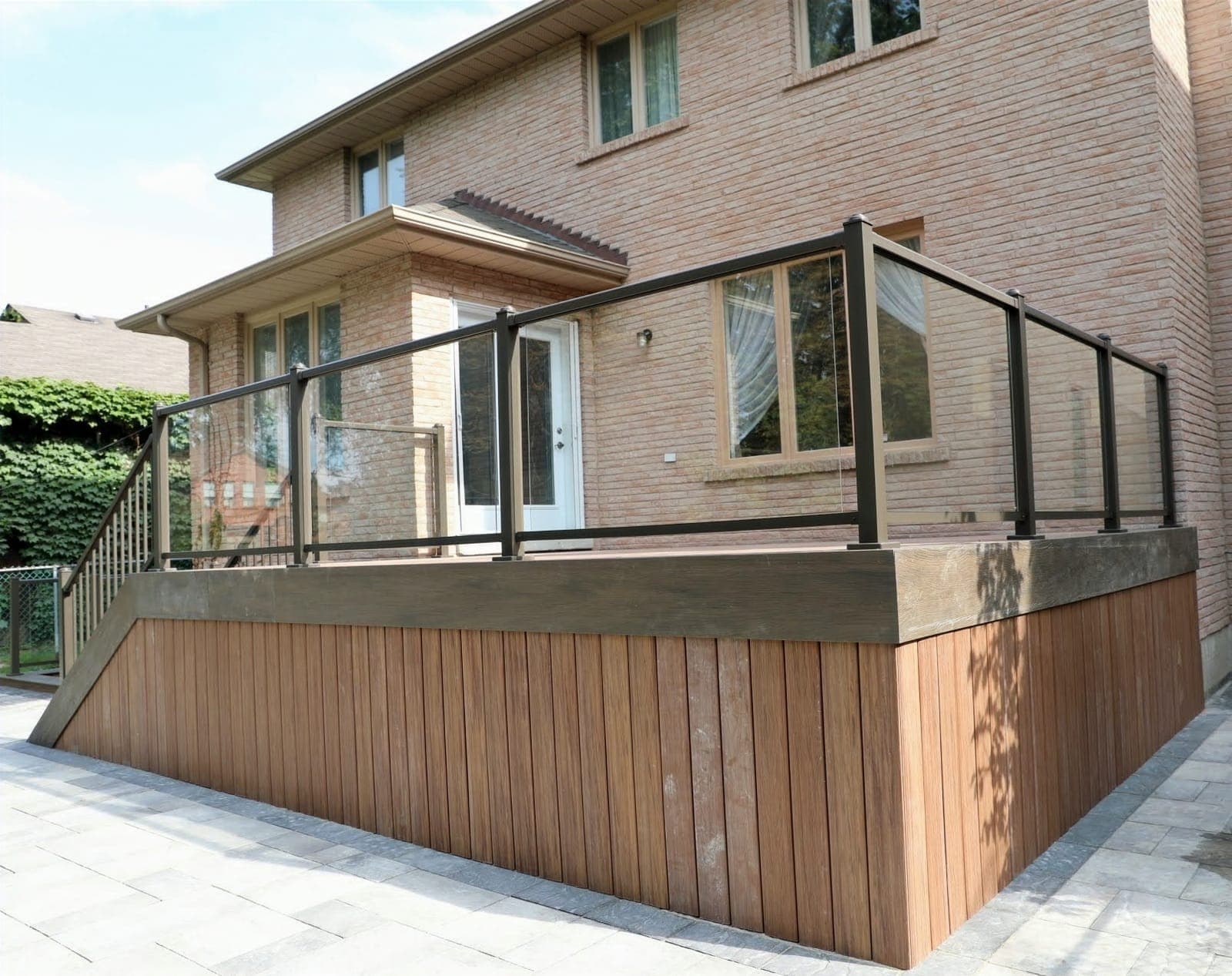 Composite deck with glass railing